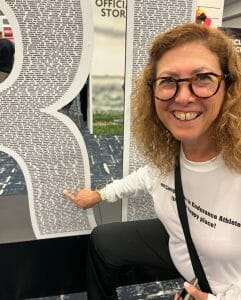 Hilary pointing to her name at the expo