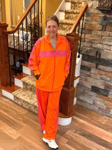hilary wearing an adidas track suit with trail shoes