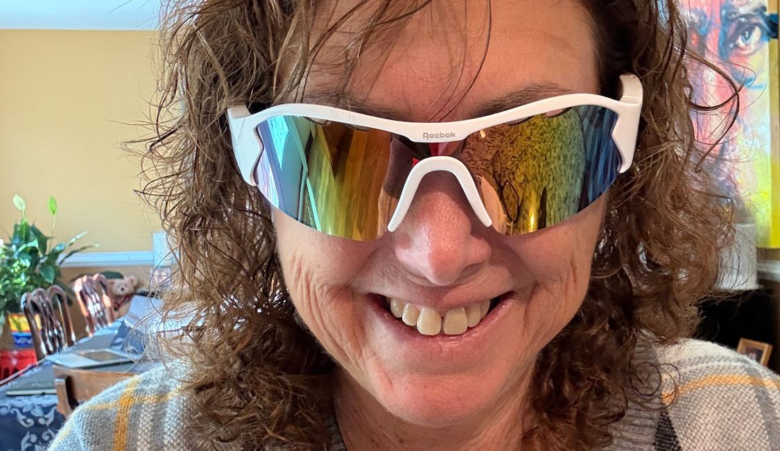 Hilary Topper wearing reebok/lucyd smart glasses