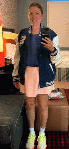 pink skort and varsity jacket